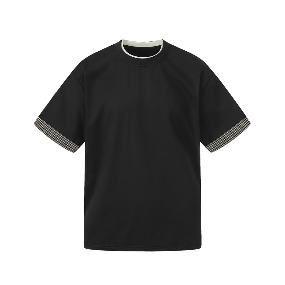 Black short-sleeve crew-neck tee with cream neckline trim and black-and-white plaid cuffs, flat front view
