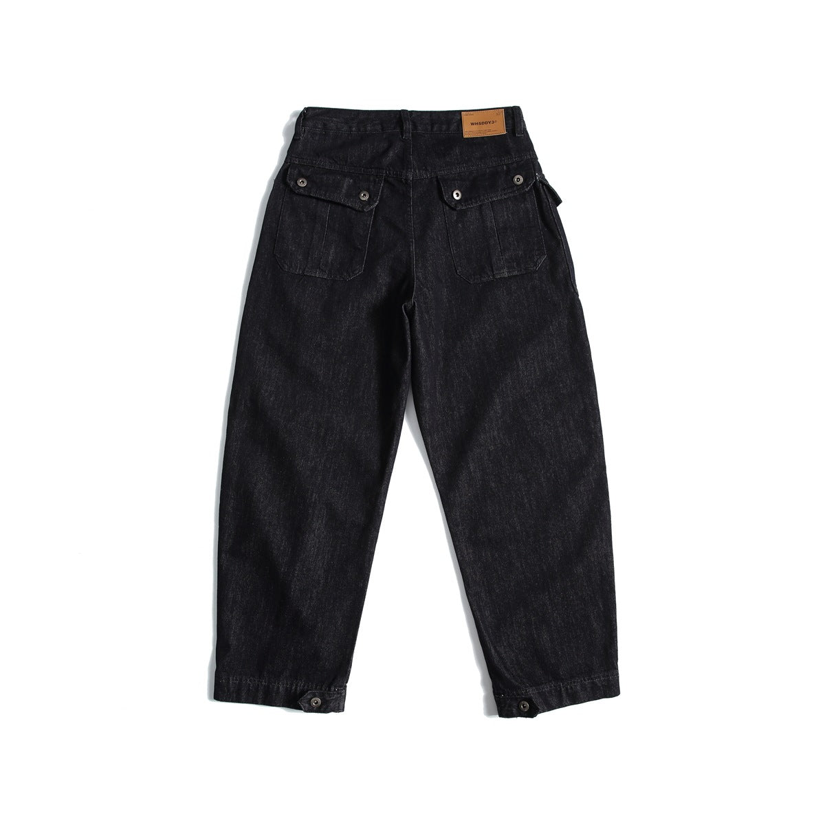 Back view of black-blue washed denim jeans with flap pockets, back waist patch and button tabs at the hems