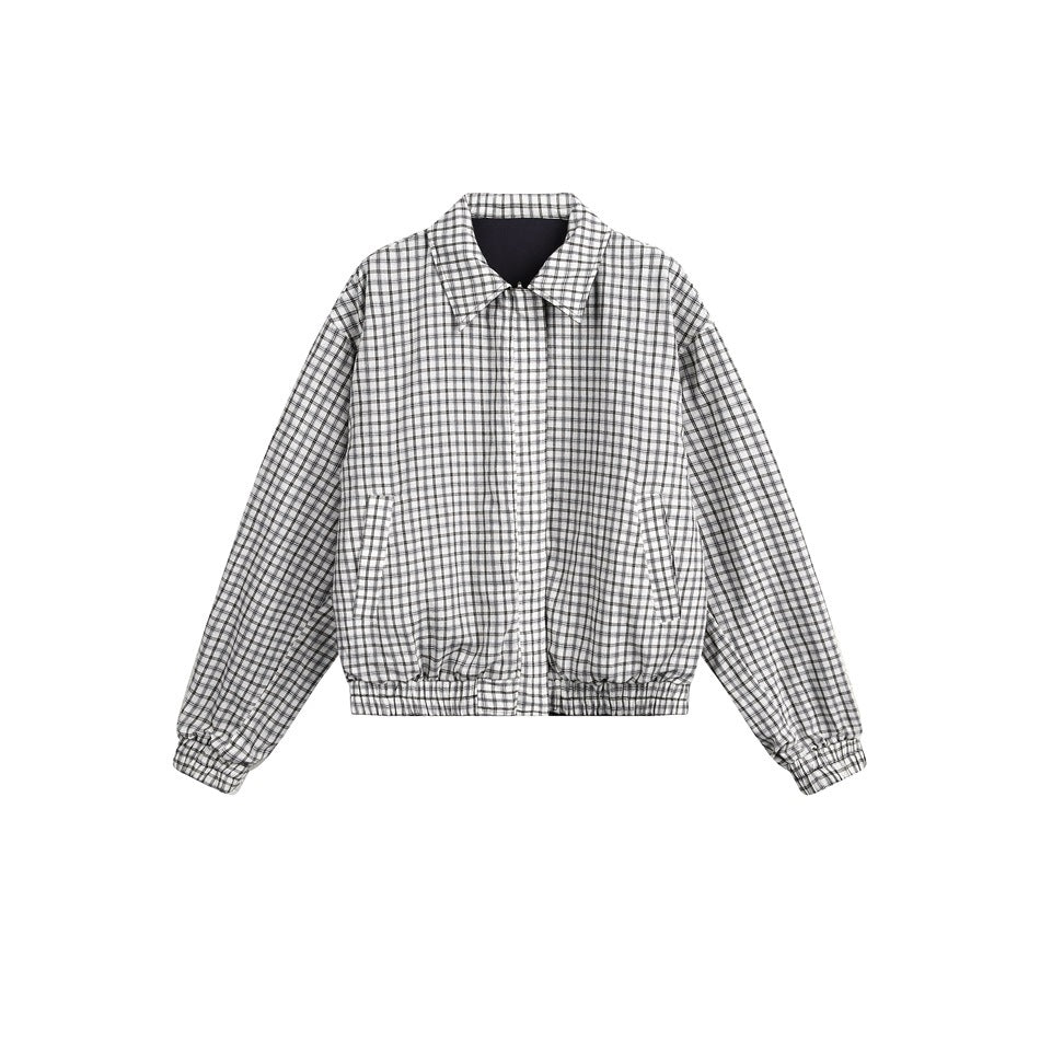 Front view of a white jacket with a fine black check pattern, pointed collar, zip front, slanted pockets and elastic trim.
