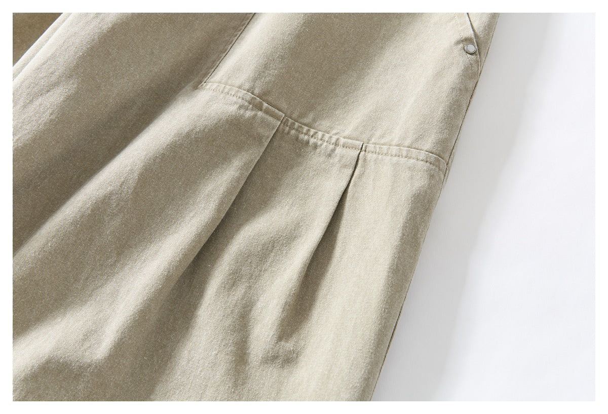 Close-up of stitched panels and a seam on light khaki bottoms.