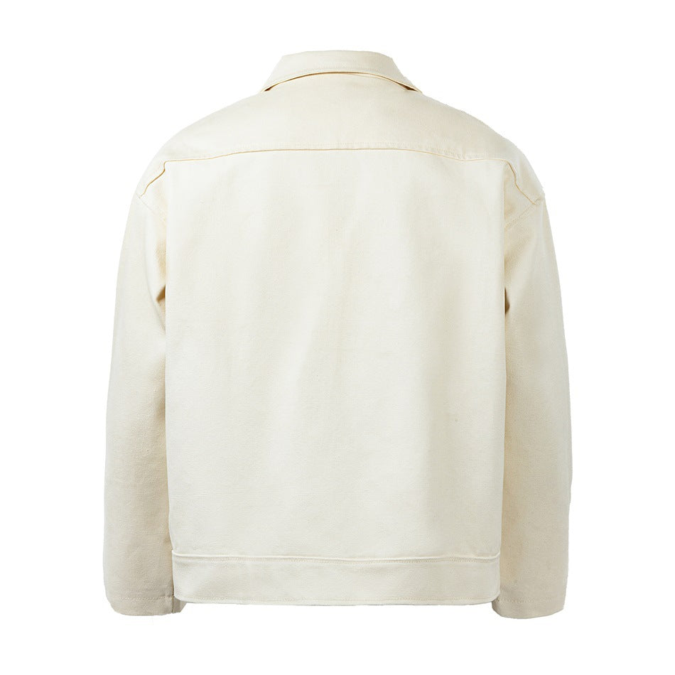 Back view of a cream jacket with seamed yoke, banded hem and long sleeves
