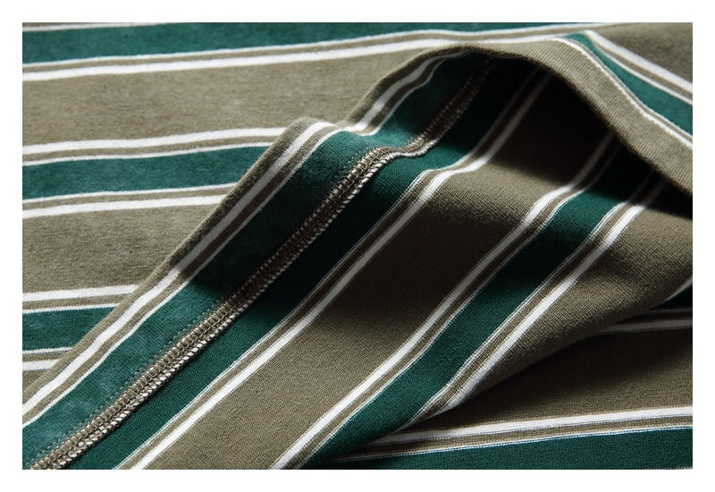 Close-up of the striped T-shirt fabric and stitched garment seam.