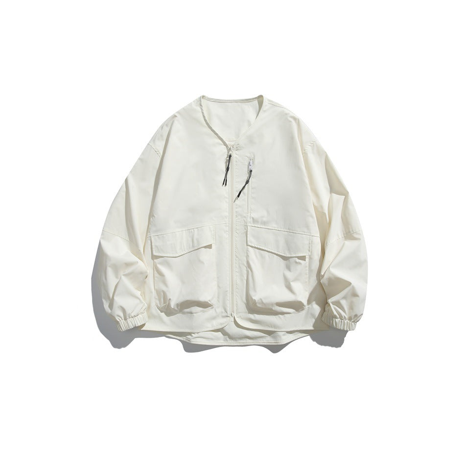Off-white collarless zip jacket with two large flap pockets and elastic cuffs, flat lay front view