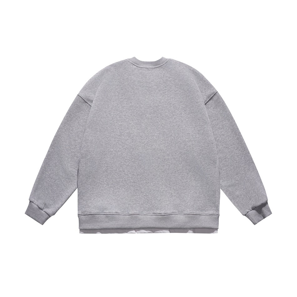 Back view of a plain gray crewneck sweatshirt with long sleeves, ribbed cuffs, and hem.
