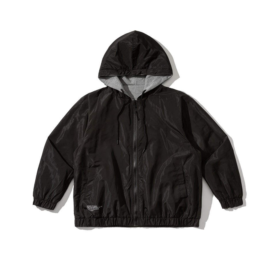 Black hooded zip jacket with glossy shell, black drawstrings, gray hood lining, elastic cuffs and hem, laid flat