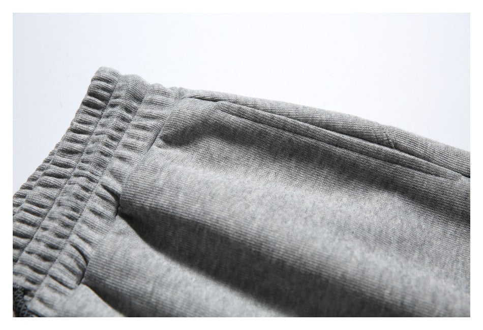 Close-up of the gray jogger pants waistband and adjacent fabric.