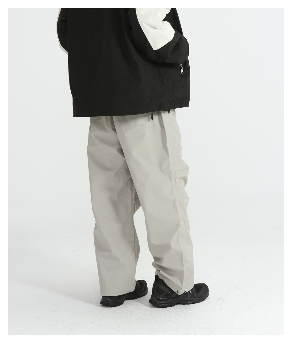 Rear three-quarter view of a person wearing light gray cargo pants with black shoes; upper body is cropped.