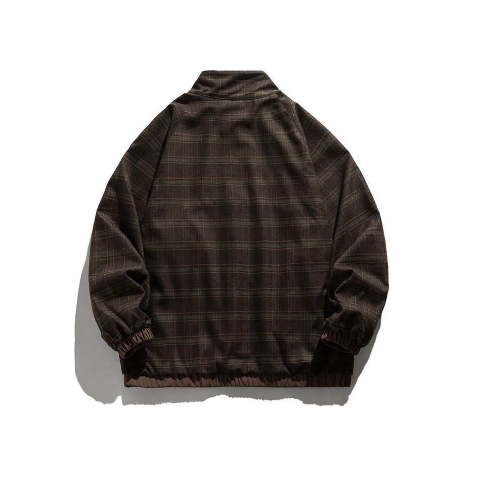 Back view of a dark brown plaid jacket with a stand collar, raglan sleeves, elastic cuffs and hem.