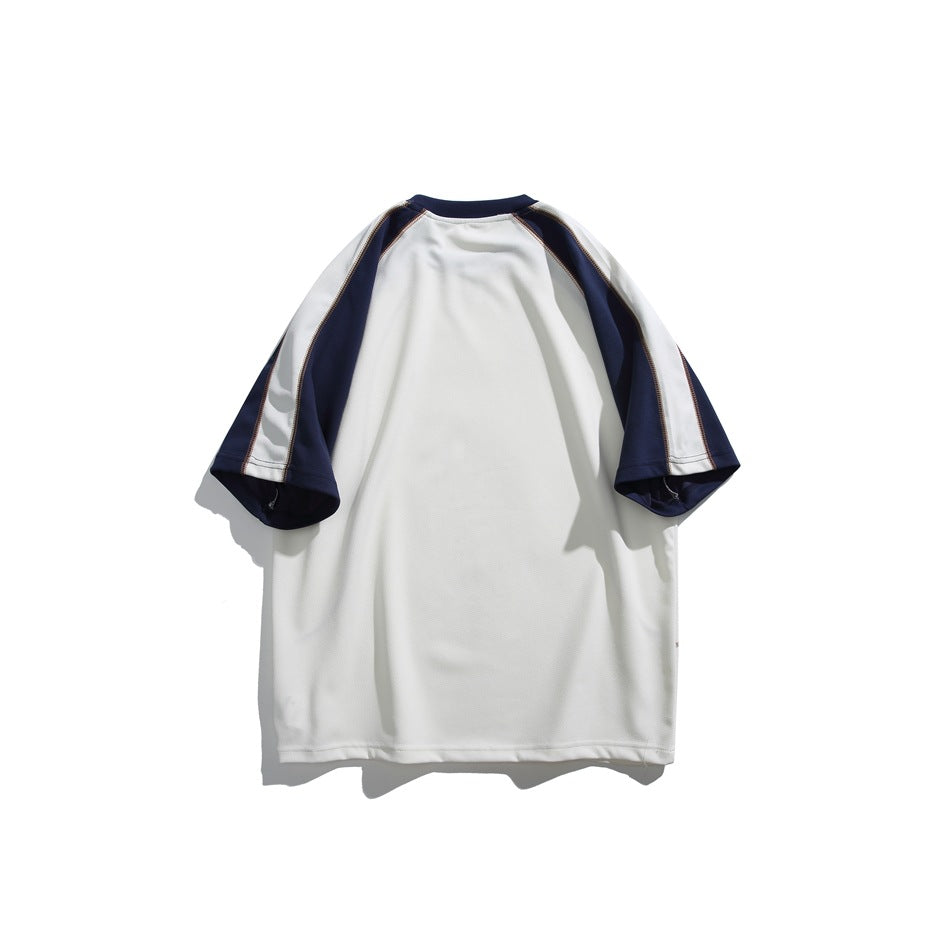Back view of an ivory short-sleeve shirt with navy raglan panels and a navy crew neck.