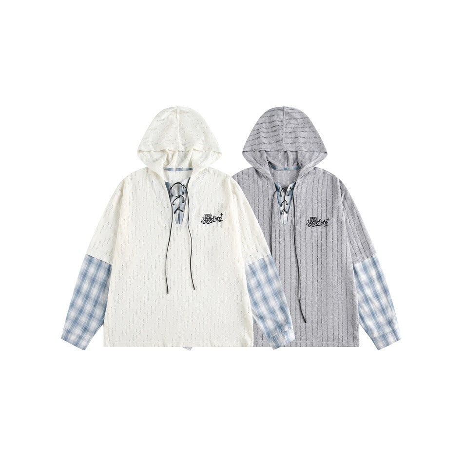 Two hooded tops shown side by side in cream and gray, both with blue plaid sleeves and lace-up necklines.