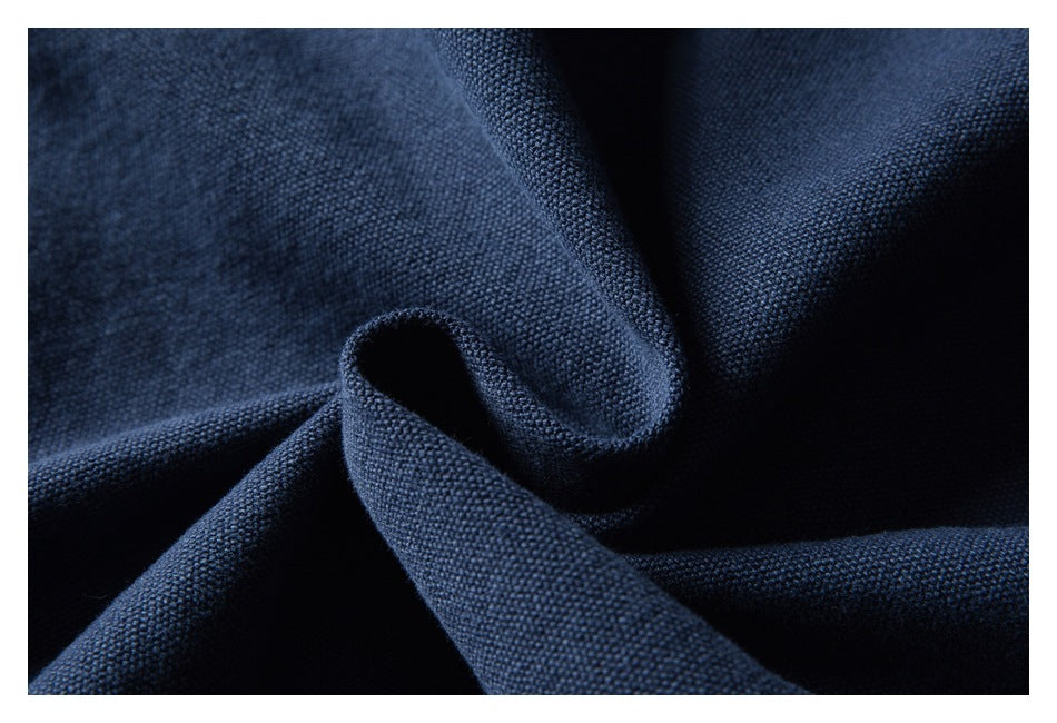 Close-up showing the textured dark navy fabric draped into soft folds.