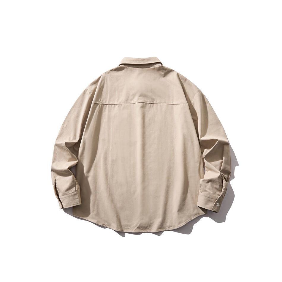 Back view of a beige long-sleeve button-up shirt laid flat, showing its shoulder yoke and curved hem.