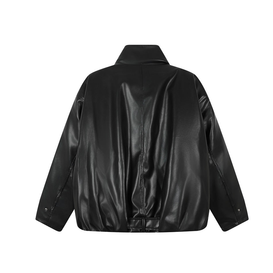 Back of a black jacket with a high collar, long sleeves, center seam, and adjustable hem tabs.