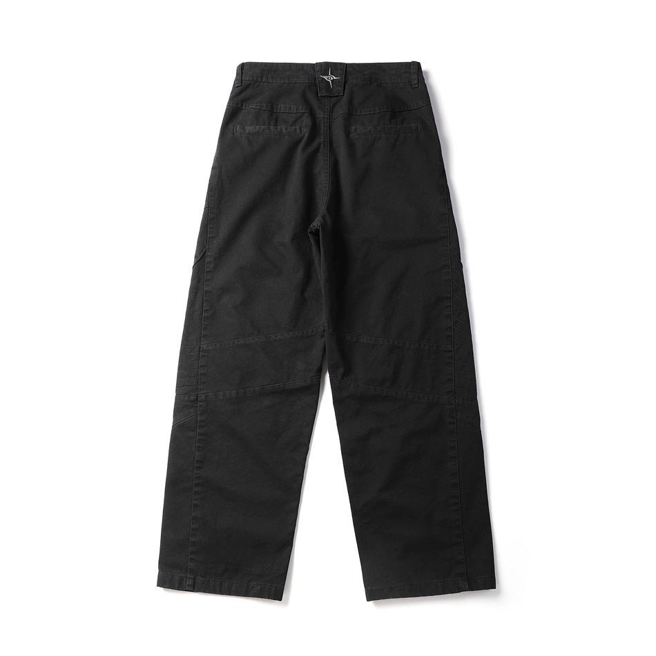 Black wide-leg pants flat lay, back view, with two back pockets and a star emblem on the waistband tab