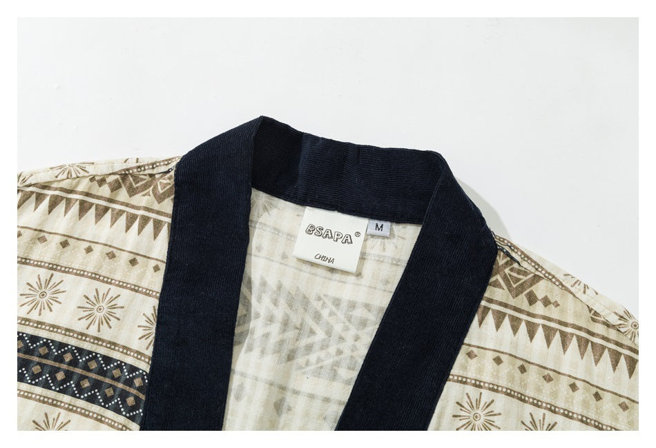 Close-up of the shirt's navy collar, cream geometric print, and sewn neck label.