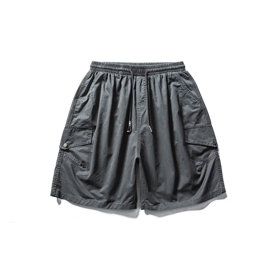 Washed dark gray cargo shorts flat lay, front view, with drawstring waist and snap flap cargo pockets
