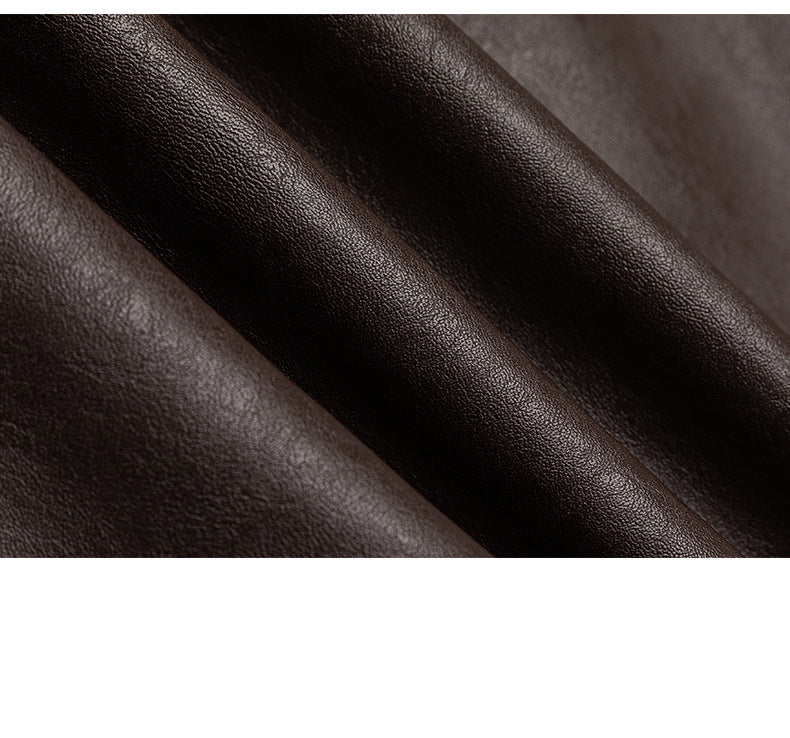 Close-up of dark brown pebbled material folded into soft diagonal ridges.