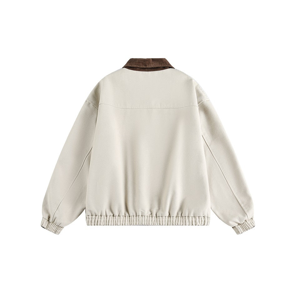 Back view of an ivory zip-up jacket with a brown collar and elastic cuffs and hem, on white.