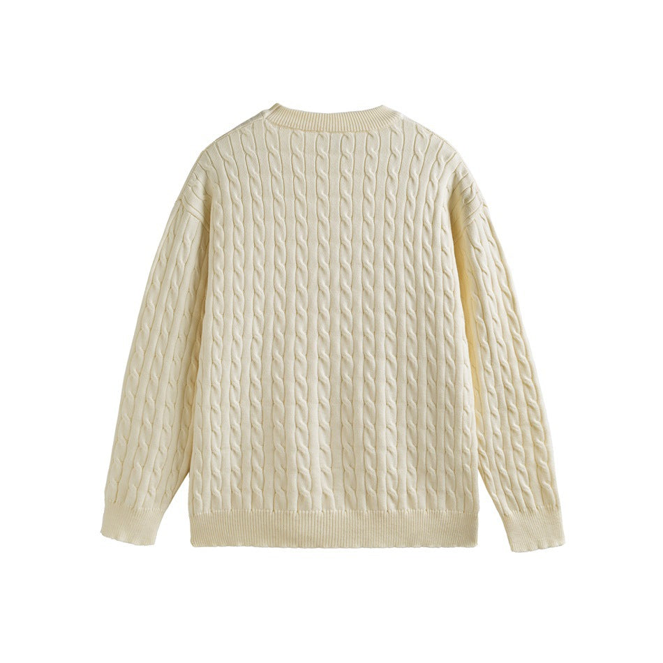 Back view of an ivory cable-knit crewneck sweater with ribbed trim.