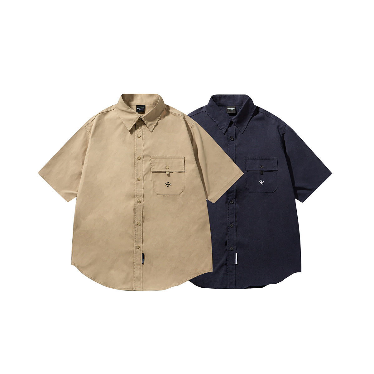Beige and dark navy short-sleeve button-up shirts shown from the front, each with a flap chest pocket.