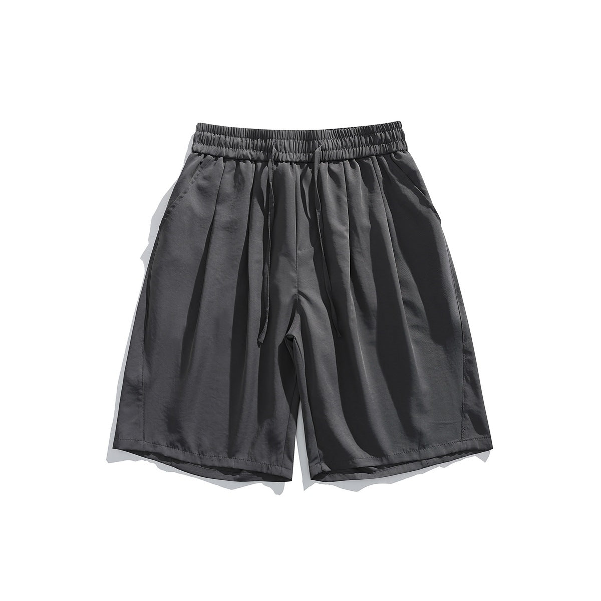 Dark gray knee-length shorts with drawstring waistband, front pleats and side pockets, flat lay front view