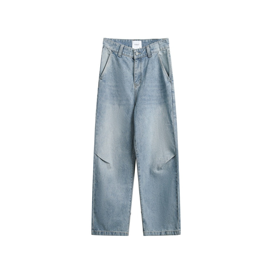 Light blue washed wide-leg jeans flat lay, front view with button fly, side pockets and knee folds