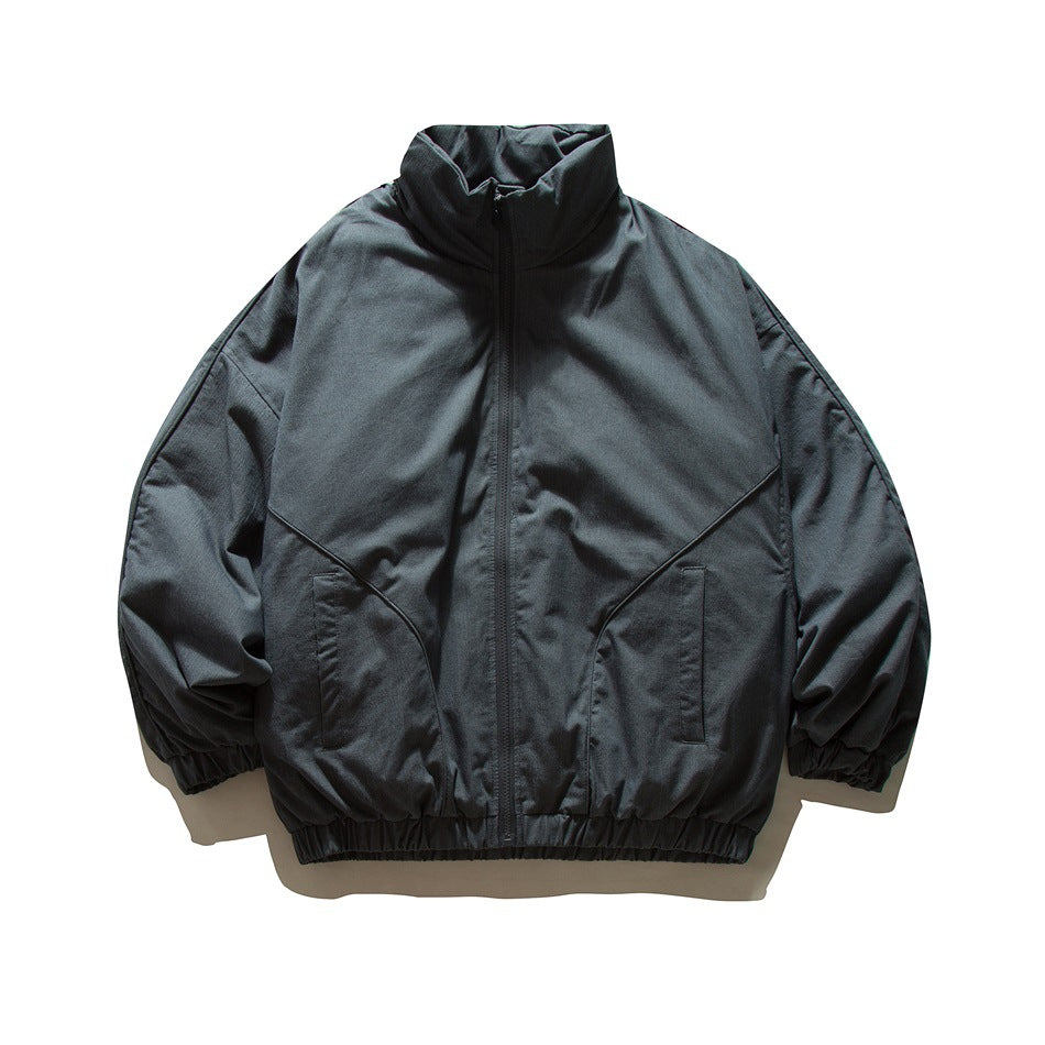 Dark navy-gray zip-front stand-collar jacket with curved front seams, pockets and elastic cuffs and hem, flat lay