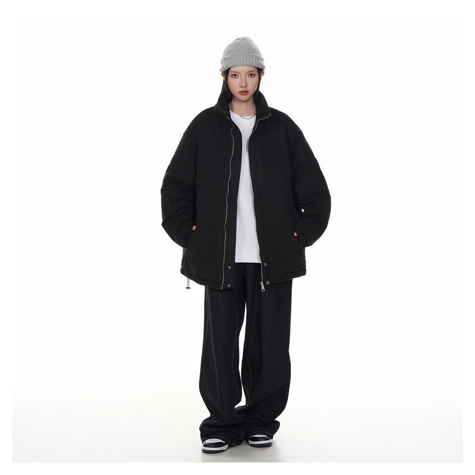 Full-length model wearing an open black padded jacket with a high collar and front zipper.