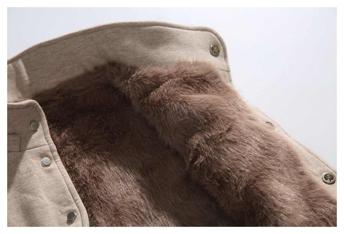 Open beige coat showing its plush brown lining and metal snap fasteners.