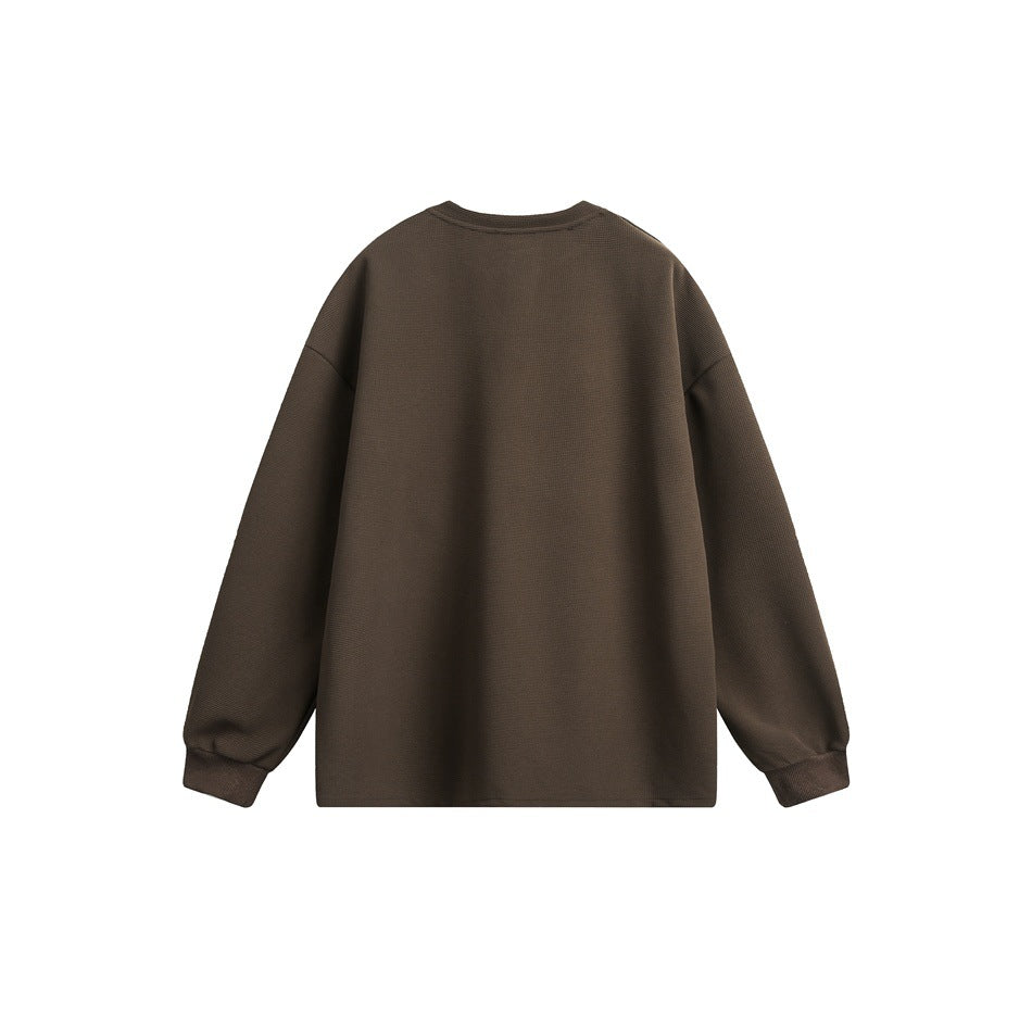 Back view of a dark brown long-sleeve shirt with a crew neckline, relaxed shoulders, and ribbed cuffs.