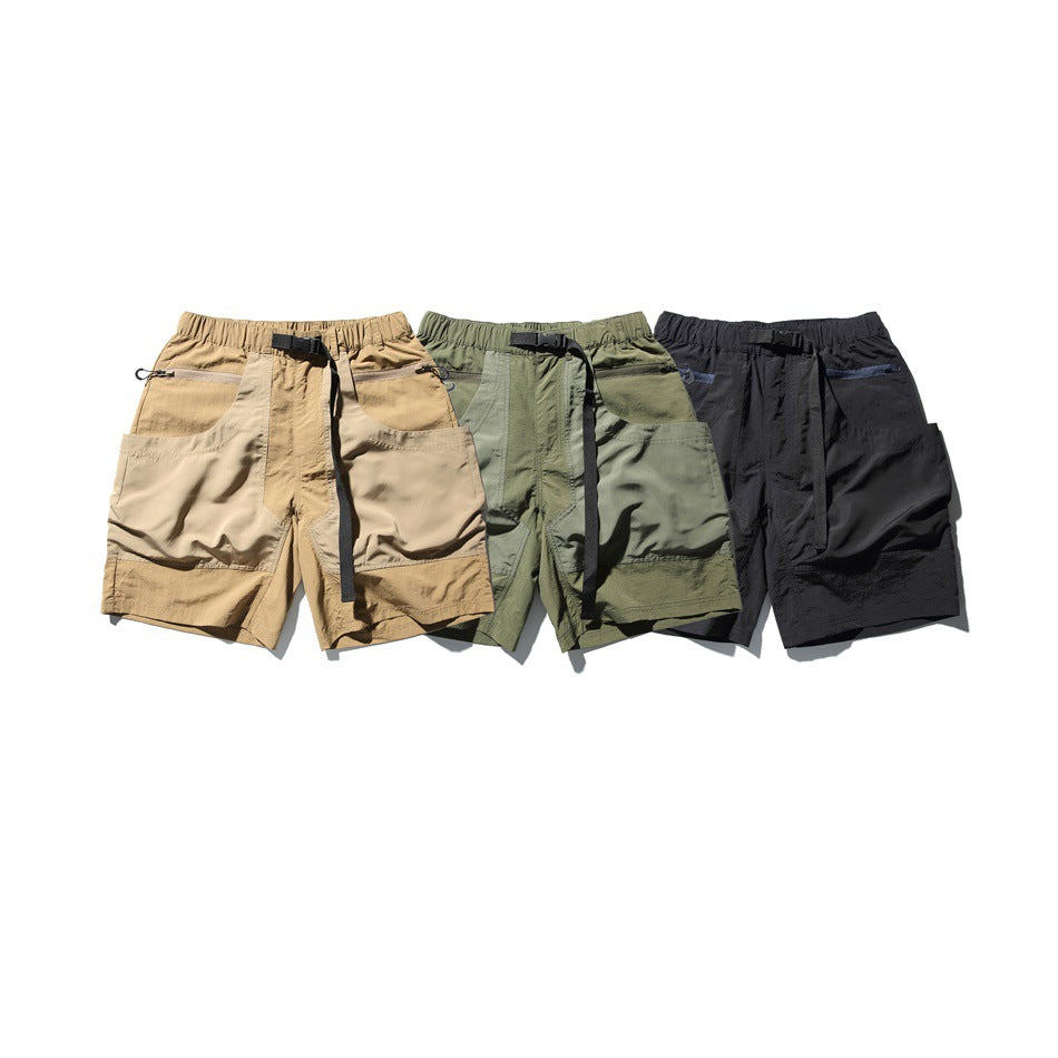Three pairs of utility shorts in tan, olive green, and black, shown from the front.