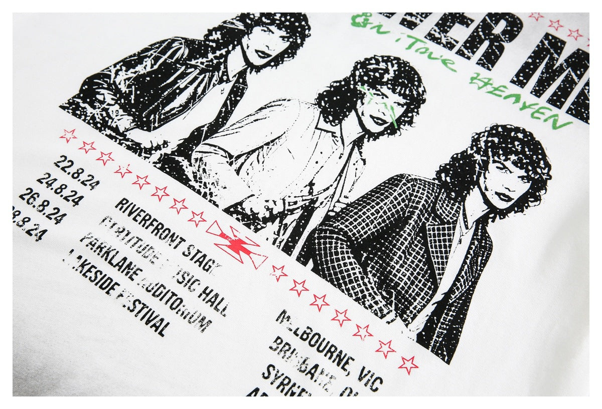 Close-up of black-and-white portrait artwork, red stars and tour-style text printed on a white T-shirt.