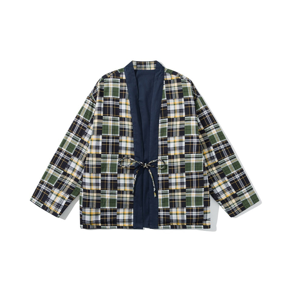 Front view of a long-sleeved plaid jacket with navy trim, a matching waist tie, and a navy inner panel.