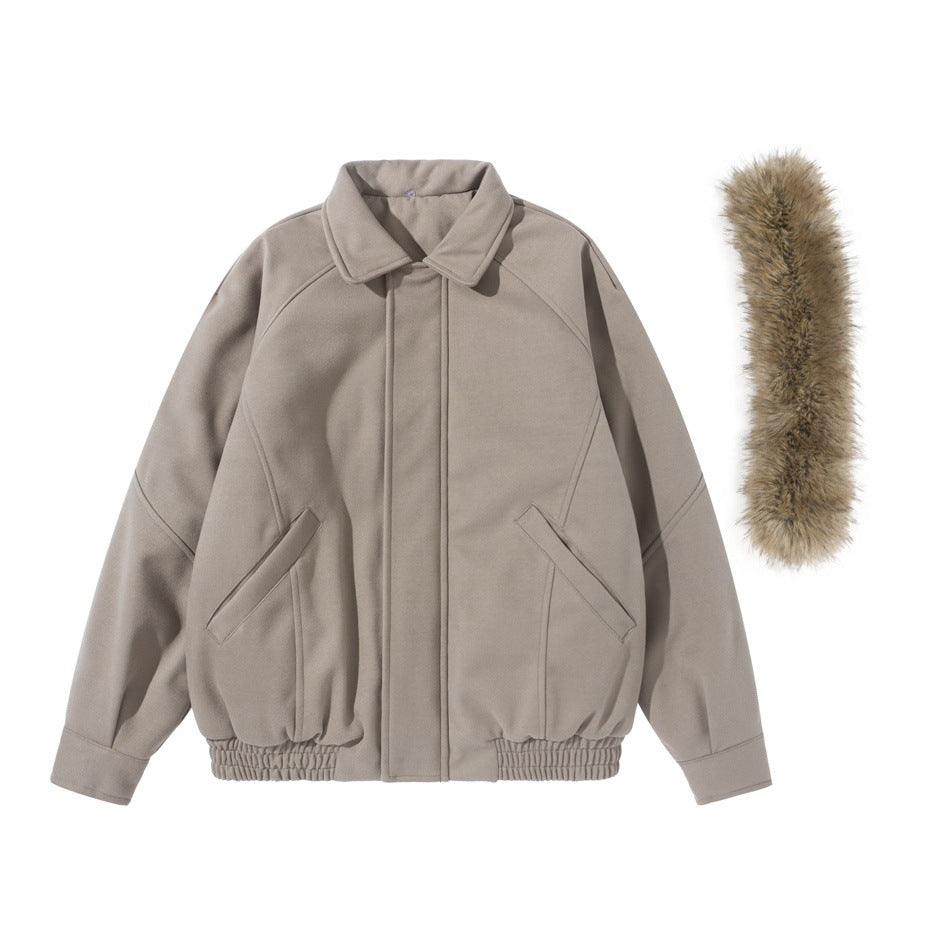 Front view of a taupe jacket with a pointed collar, angled pockets, and gathered hem; detachable tan fur trim is shown beside