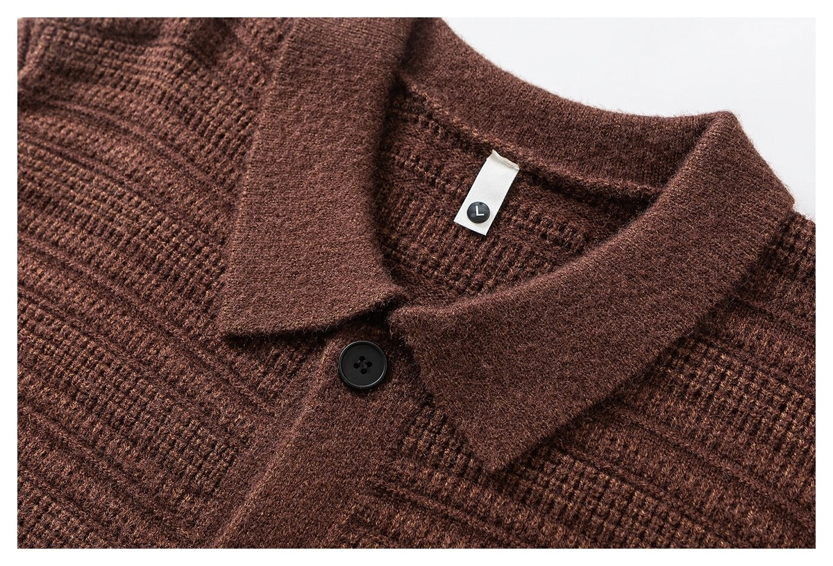 Close-up of a brown knit cardigan collar, black button, and white size tag marked L.