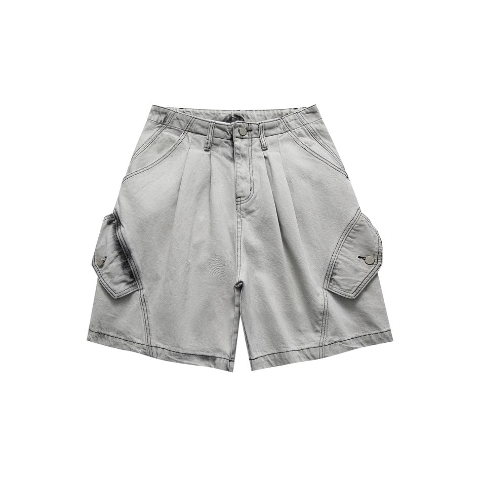 Light gray washed denim-style shorts, front view, with pleats, zip fly and large side flap pockets