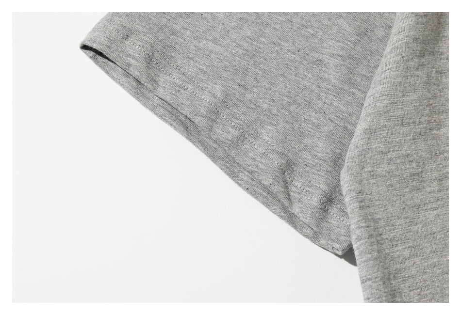 Close-up of the heather gray T-shirt's short sleeve and stitched hem.