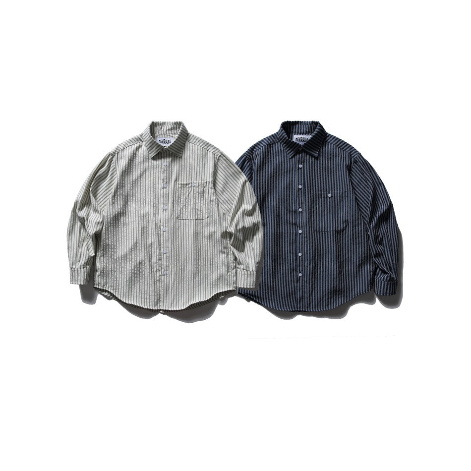 Two collared button-front shirts shown from the front: one light with dark stripes and one dark with light stripes.