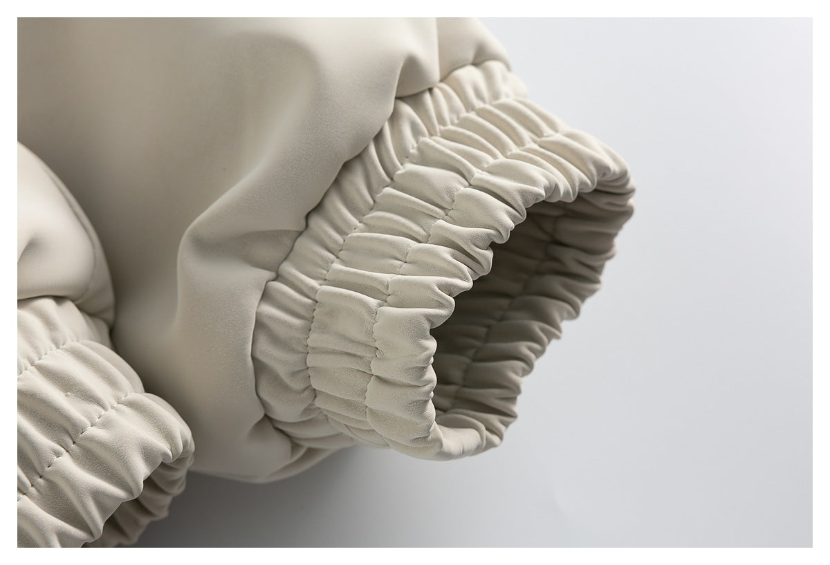 Close-up of the jacket's gathered elastic sleeve cuff and stitched finish.