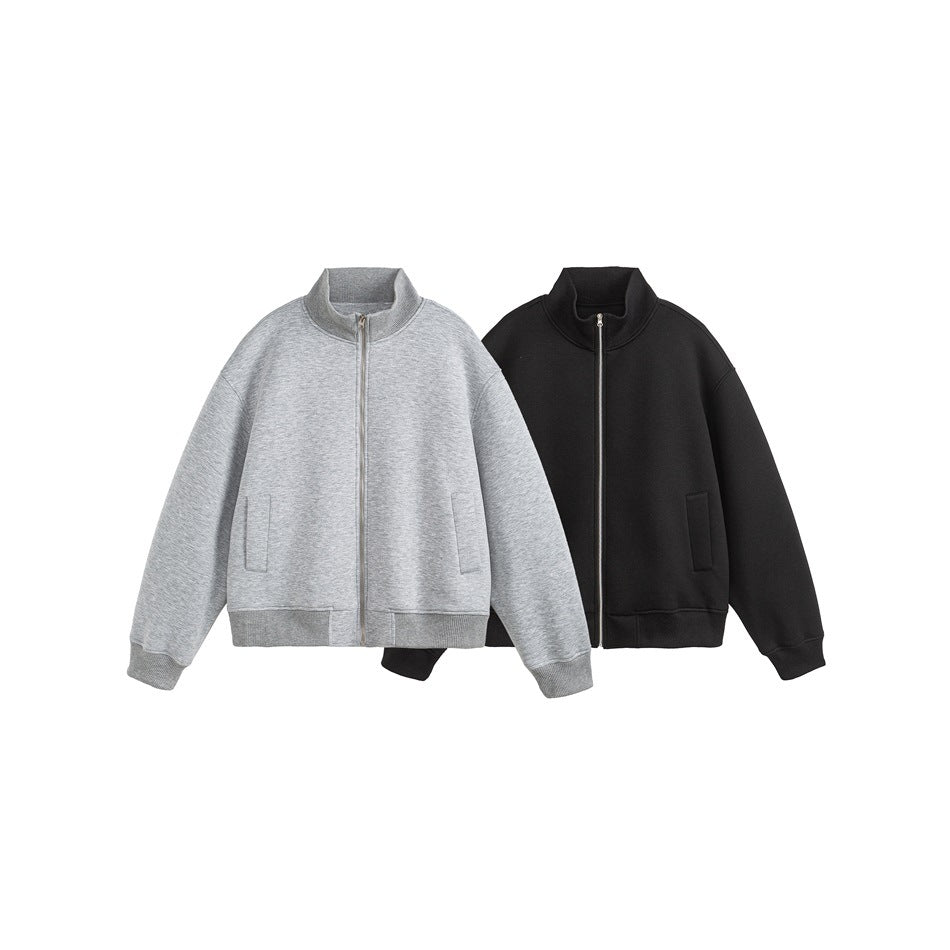 Two zip-front jackets shown together: one light gray and one black, both with stand collars and front pockets.