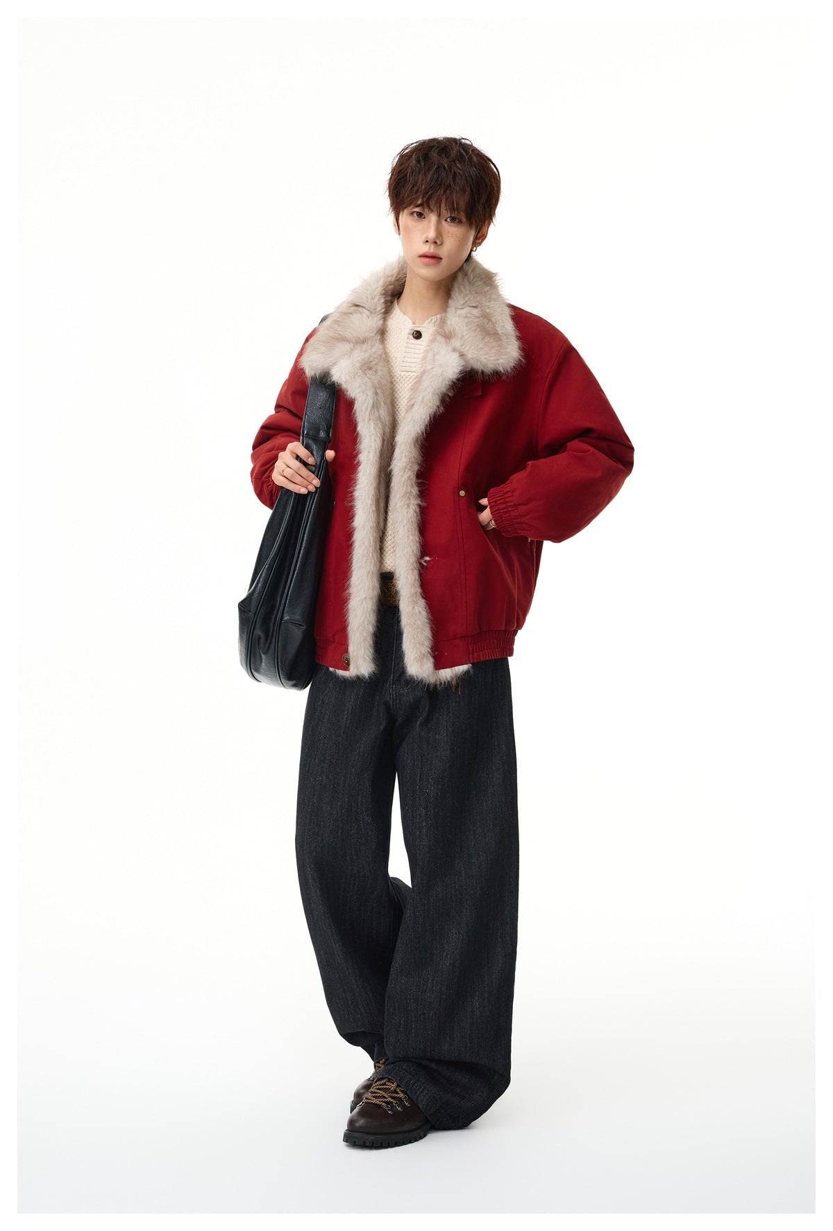 Full-length model wearing a deep red jacket with a plush beige fur-trimmed collar, wide dark jeans, and a black shoulder bag.