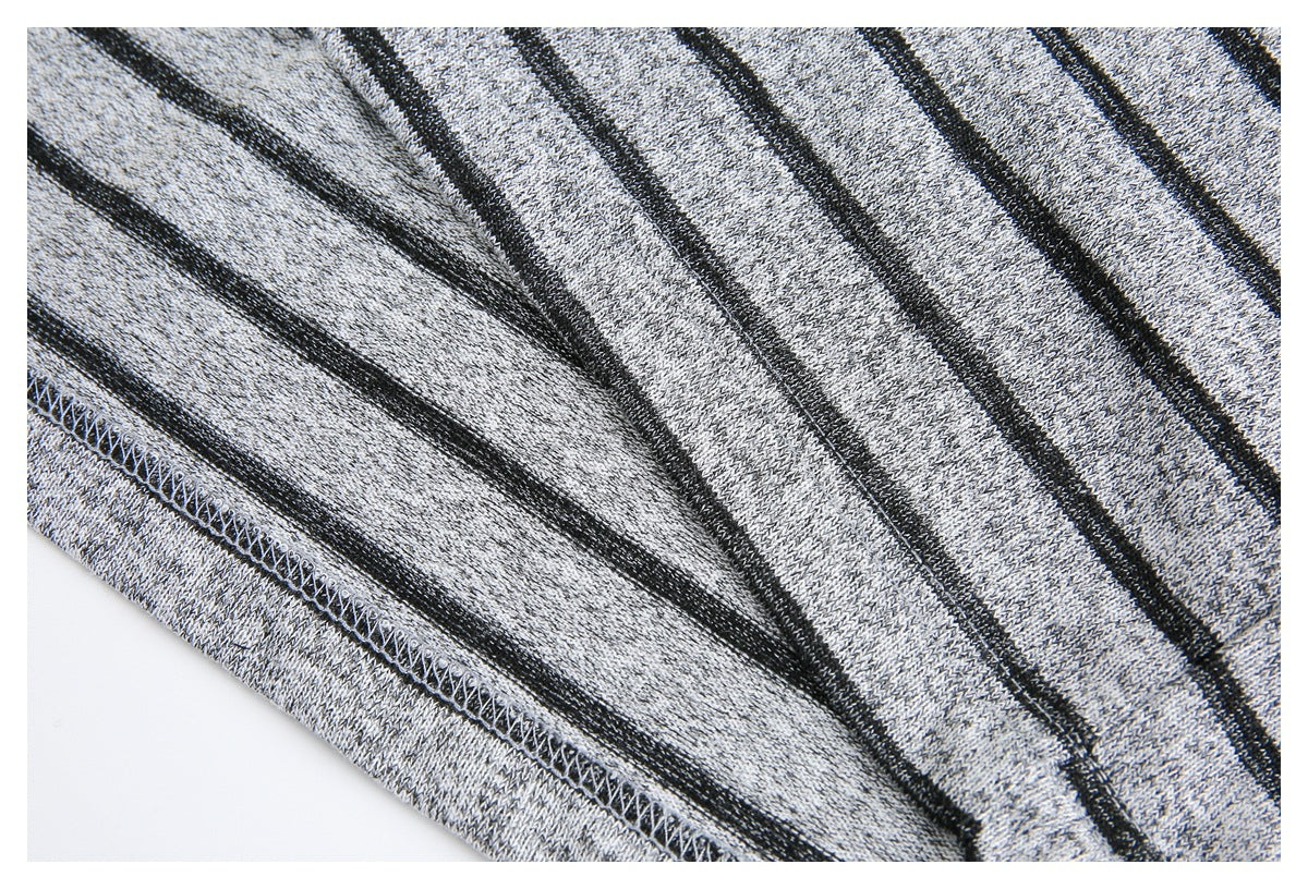 Close-up of the gray-and-black striped knit fabric showing an interior overlocked seam.