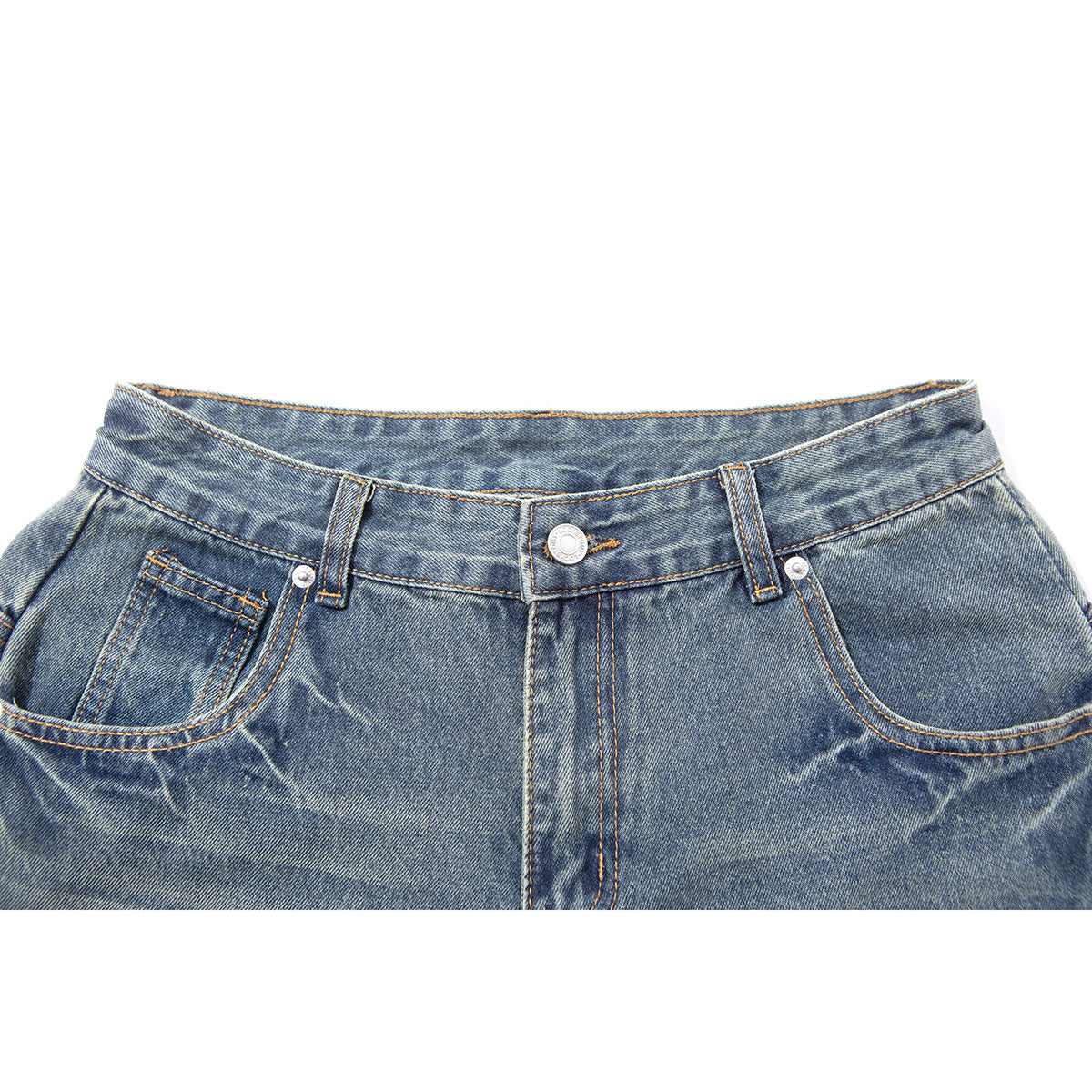Close-up of blue washed denim pants showing the front waistband, button, belt loops, fly and curved pockets.
