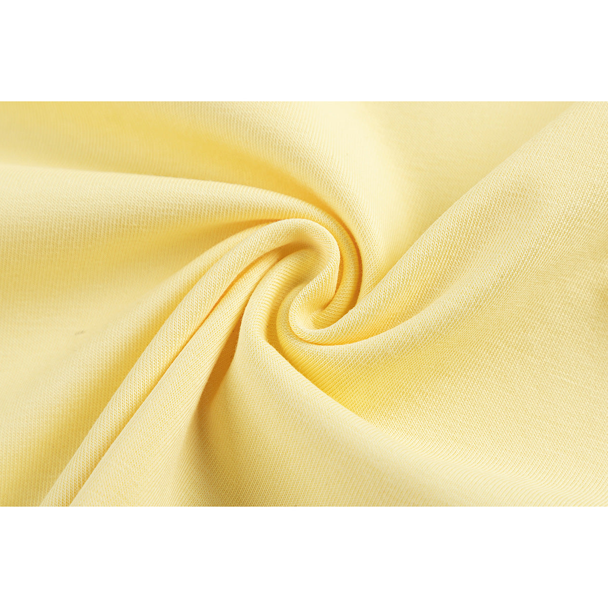 Close-up of pale yellow fabric gathered into a swirl, showing its knit texture.