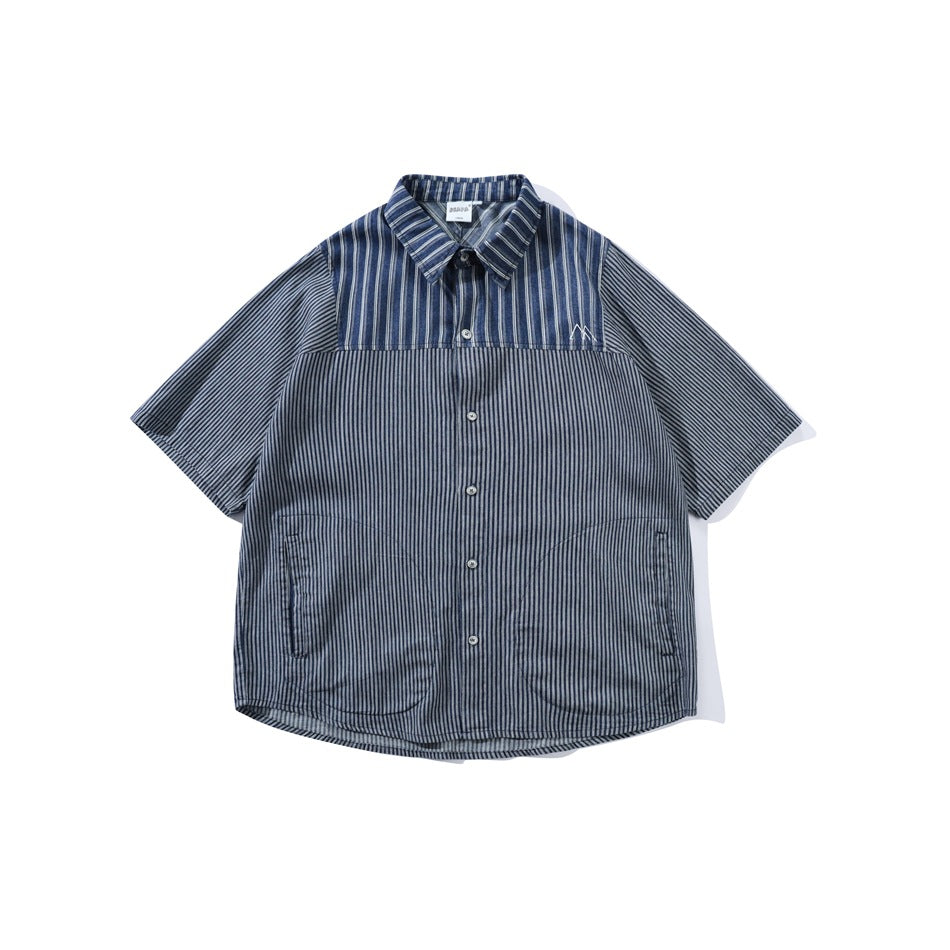 Blue vertical-striped short-sleeve button-up shirt with darker striped yoke and collar and two curved front pockets, flat lay