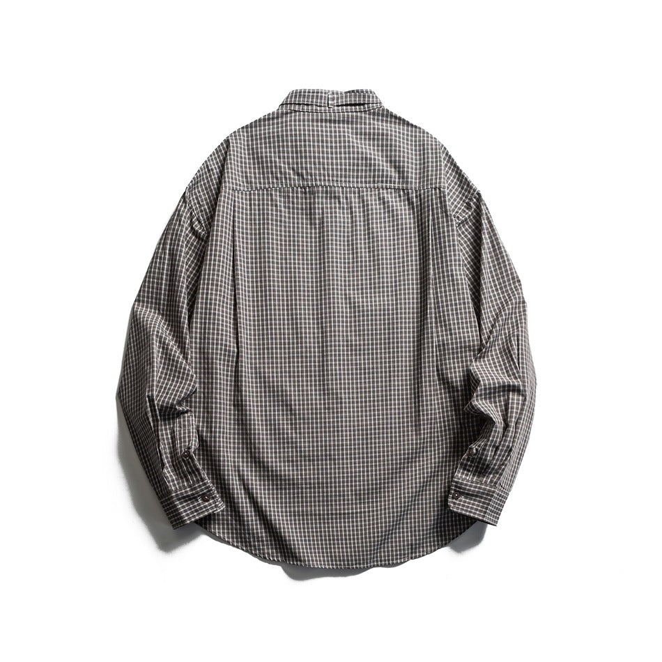Back view of a gray and dark plaid long-sleeve shirt laid flat on a white background.
