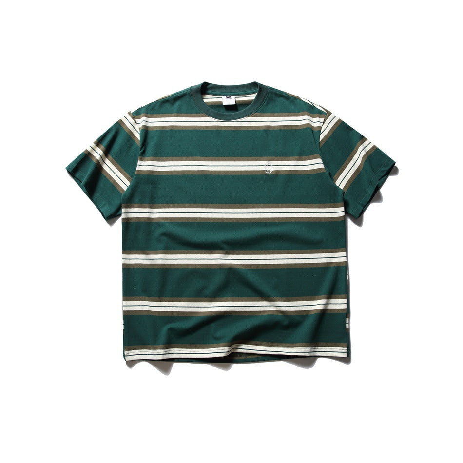 Green short-sleeve crew neck T-shirt with cream and olive-brown horizontal stripes and a small chest embroidery, flat lay