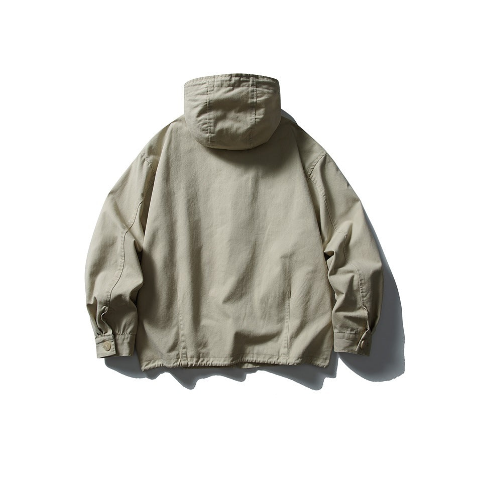Back view of a light beige hooded jacket with long sleeves and buttoned cuffs, displayed flat on white.