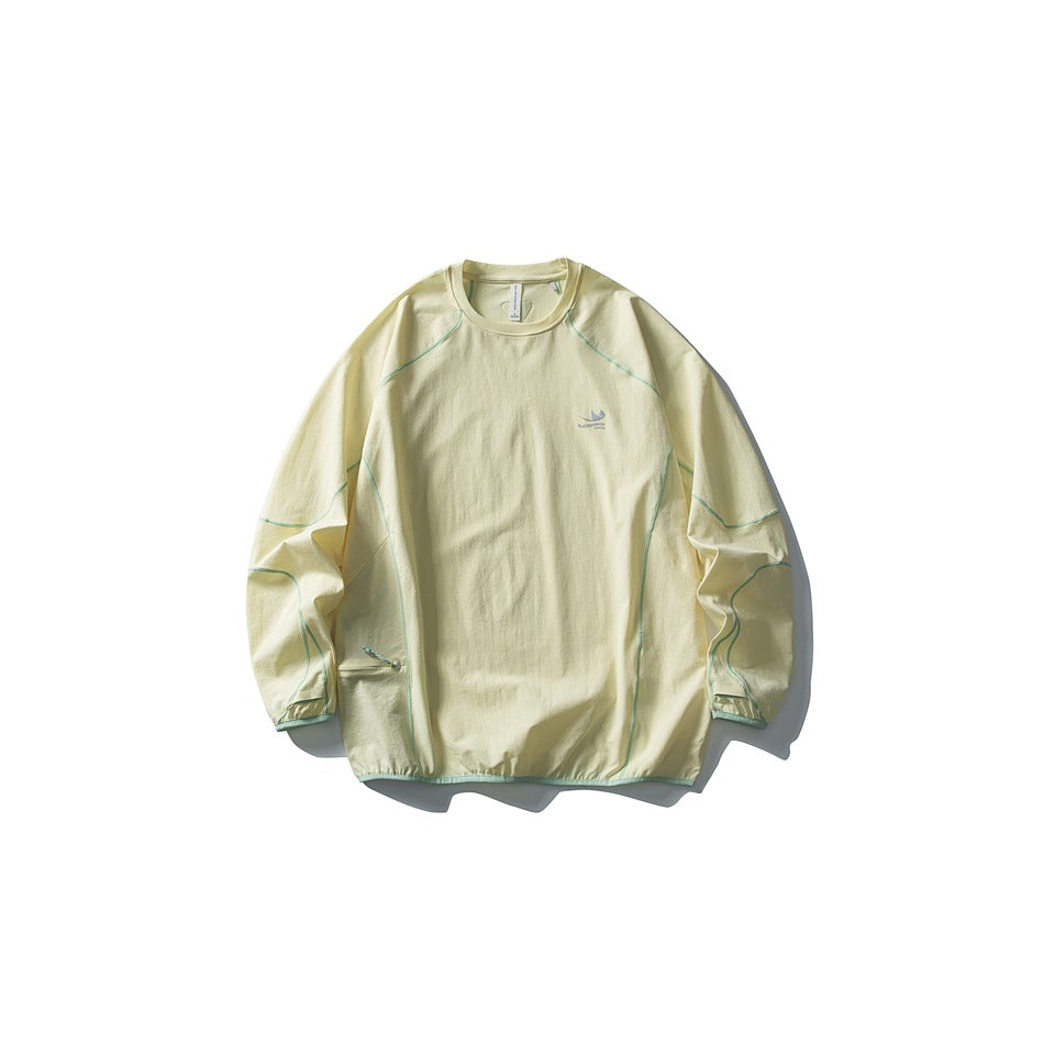 Cream yellow long-sleeve crew-neck top flat lay with mint contrast piping and gathered hem