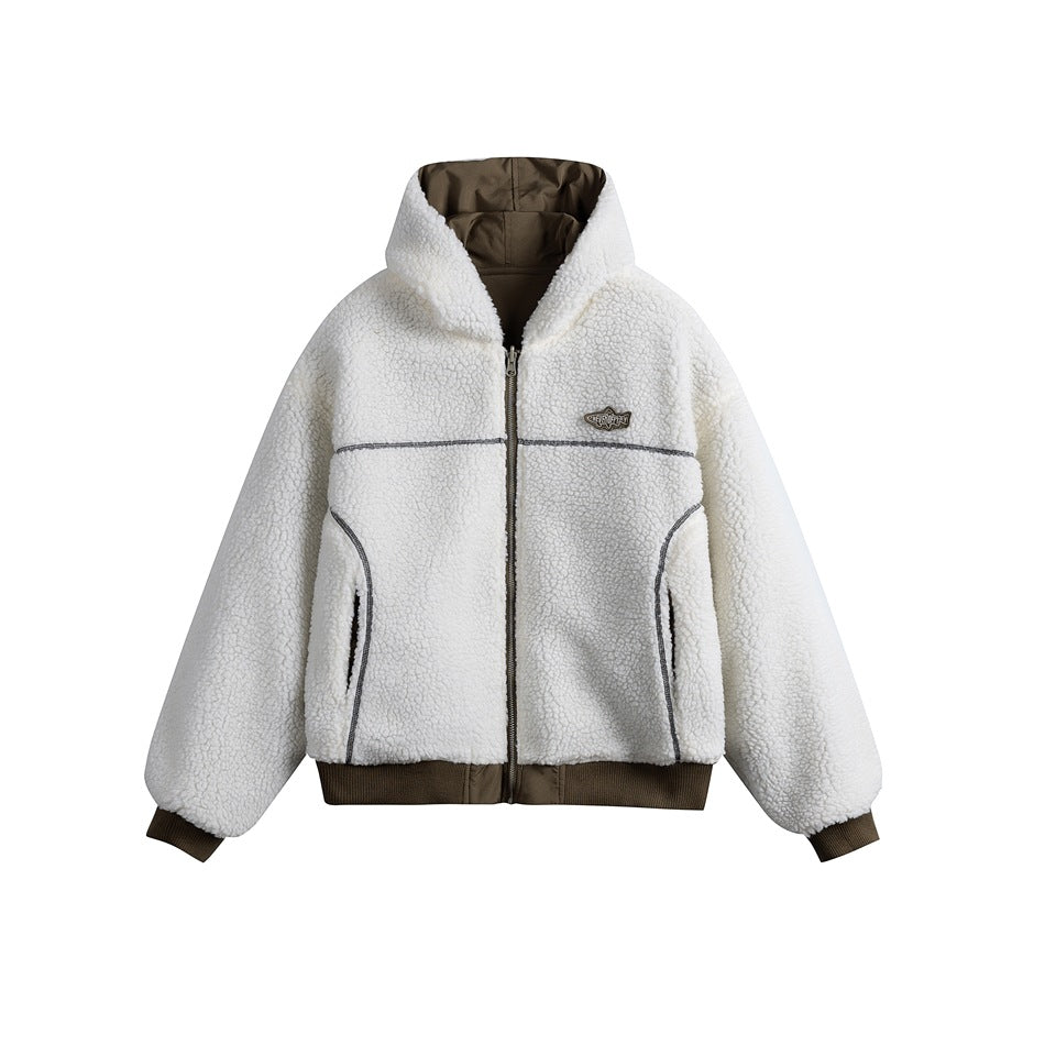 Front view of an ivory sherpa zip-up hooded jacket with dark trim, brown ribbed cuffs and hem, and a chest patch.